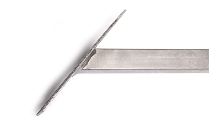 Close-up view of the angled ground base for a temporary fence windbrace, showing a square tube welded to a flat plate.