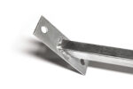 Closer detail view of the angled base plate for a temporary fence windbrace, showing anchoring holes and the welded joint to the square post.