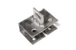 An oblique view of a separate galvanized steel anchor base plate, featuring corner holes and a slotted vertical tab in the center.