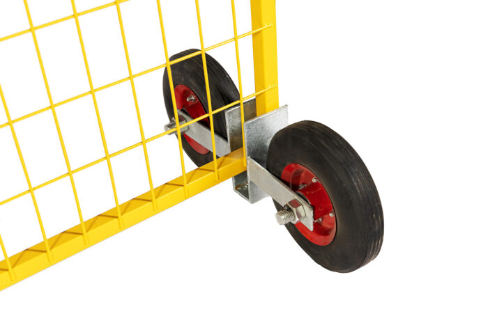 A close-up angle showing the bottom frame of a yellow temporary fence panel slotted into a galvanized wheel assembly with two solid rubber tires and red rims.