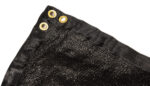 A close-up detail of a black temporary fence privacy screen, highlighting the durable woven fabric texture, double-stitched reinforced corner, and sturdy brass mounting grommets.