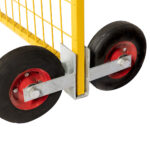 A detailed front-side view of a yellow temporary fence panel supported by a dual-wheel assembly, highlighting the heavy-duty galvanized steel bracket and bolted wheel axles.