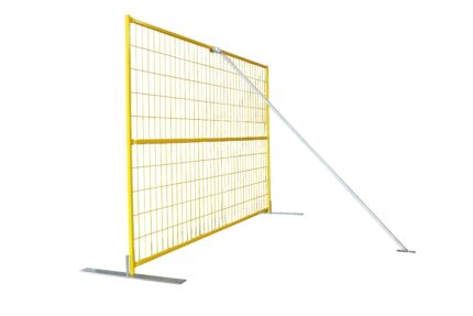 A yellow mesh temporary fence panel installed on flat metal bases and stabilized by a diagonal silver windbrace.